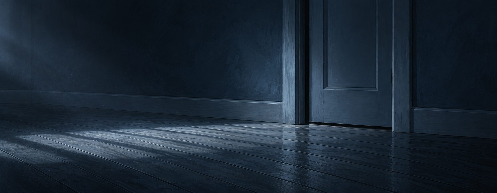 A hallway at first light, the door to the next room closed